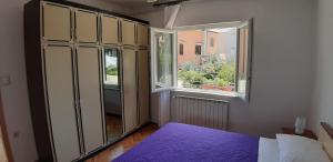 Postel nebo postele na pokoji v ubytování Apartmani Ana