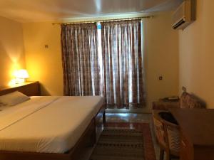 Posteľ alebo postele v izbe v ubytovaní Maple Leaf Korean Hotel