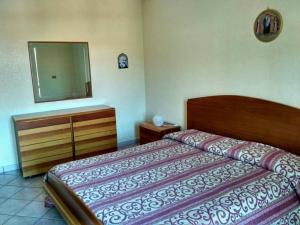 מיטה או מיטות בחדר ב-Casa Amoroso