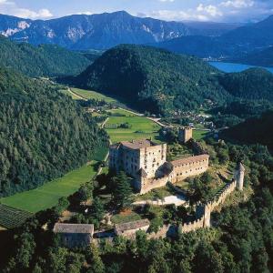 an aerial view of a castle in the mountains at da Rosemarie in Levico Terme