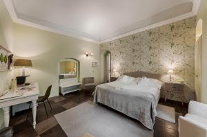 Postel nebo postele na pokoji v ubytování Locanda Don Serafino Historical Boutique Hotel