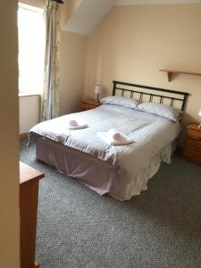 Una cama o camas en una habitación de 2a Ardaravan Square