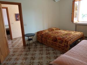 a bedroom with a bed and a table in a room at Le dimore di Flora Charme in Monopoli +29 photos