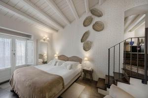 Postel nebo postele na pokoji v ubytování Locanda Don Serafino Historical Boutique Hotel