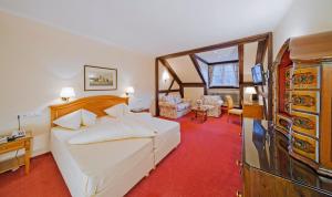 Posteľ alebo postele v izbe v ubytovaní Vergeiner's Hotel Traube