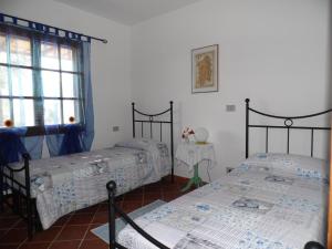 Postel nebo postele na pokoji v ubytování Villa L'Oleandro