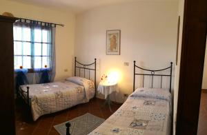 Postel nebo postele na pokoji v ubytování Villa L'Oleandro + 37 fotografií