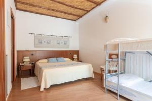 Ένα ή περισσότερα κρεβάτια σε δωμάτιο στο Hotel Villa Canu +63 φωτογραφίες