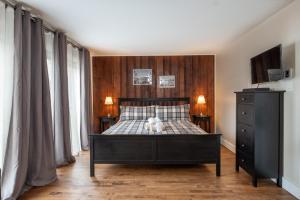 Postel nebo postele na pokoji v ubytování Auberge Sauvignon