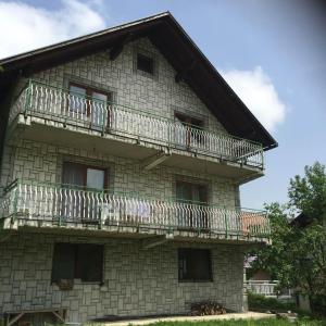 a building with balconies on the side of it at Amar Apartmani, Jajce in Jajce