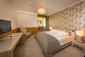Postel nebo postele na pokoji v ubytování Hotel Freizeittempel