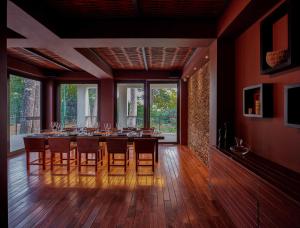 a dining room with a long table and chairs at Taj Exotica Resort & Spa, Andamans in Havelock Island