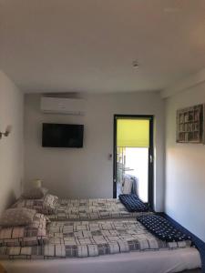 Posteľ alebo postele v izbe v ubytovaní Apartamenty Maria
