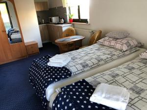 Posteľ alebo postele v izbe v ubytovaní Apartamenty Maria