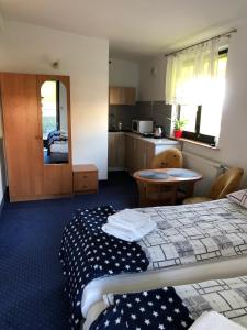 Posteľ alebo postele v izbe v ubytovaní Apartamenty Maria