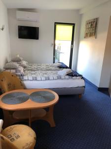 Posteľ alebo postele v izbe v ubytovaní Apartamenty Maria