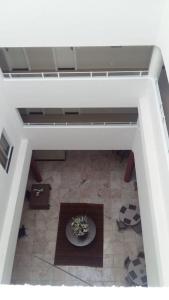 an overhead view of a living room with a table at Dunamys Hotel Londrina in Londrina