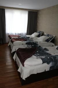 Katil atau katil-katil dalam bilik di Guesthouse Suja