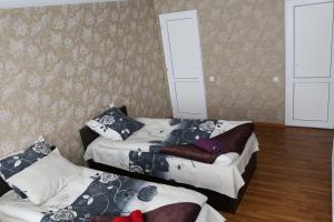 Katil atau katil-katil dalam bilik di Guesthouse Suja