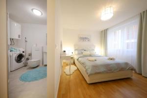 Postel nebo postele na pokoji v ubytování Rosita Deluxe Rooms + 37 fotografií