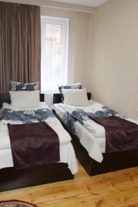 Ein Bett oder Betten in einem Zimmer der Unterkunft Guesthouse suja