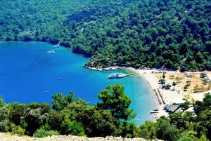 a view of a beach with boats in the water at B&B Boutique Hotel in Dalyan