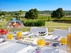 a table with a buffet of food on it at Two Rooms Hotel in Urla