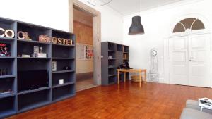 a living room filled with furniture and a window at So Cool Hostel Porto in Porto
