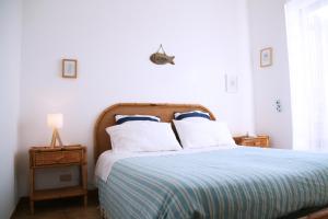 Ένα ή περισσότερα κρεβάτια σε δωμάτιο στο Casa vista Mare