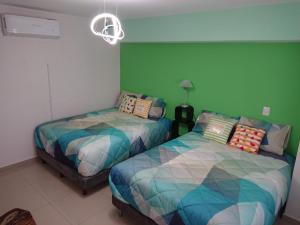 Кровать или кровати в номере Departamento Centrico Guadalajara