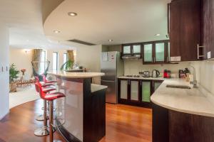 A kitchen or kitchenette at NYC Style Downtown Duplex