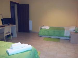 Postel nebo postele na pokoji v ubytování B&B LAVIKA PEDARA
