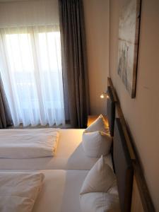 Postel nebo postele na pokoji v ubytování Gasthof Hotel Esterer