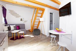 a living room with a couch and a table at Holiday home Nina in Bol