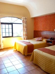 Postel nebo postele na pokoji v ubytování Hotel Virreynal