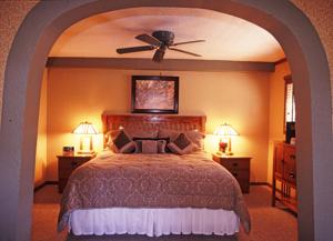 a bedroom with a bed with a ceiling fan at Lodge at Sedona in Sedona