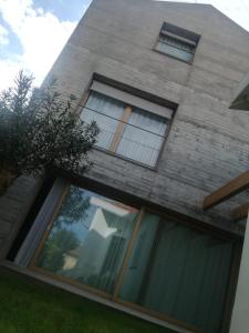 a house with large windows on the side of it at La casa di Mario...tra le case Via del Giglio 52 in Ortona