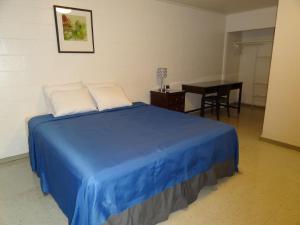 Postel nebo postele na pokoji v ubytování Tip Top Motel