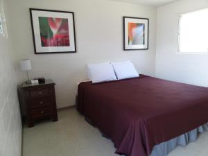 Postel nebo postele na pokoji v ubytování Tip Top Motel