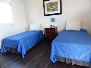 Postel nebo postele na pokoji v ubytování Tip Top Motel