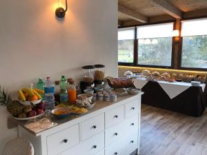 a kitchen with a lot of food on the counter at Hotel Al Ritrovo in Piazza Armerina
