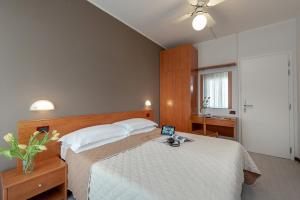 Postel nebo postele na pokoji v ubytování Hotel Pierre