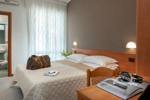Postel nebo postele na pokoji v ubytování Hotel Pierre