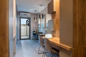 a dining room with a table and chairs at Ciel Collection Suites in Chania