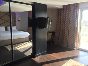 Voodi või voodid majutusasutuse Royal Maadi Hotel toas