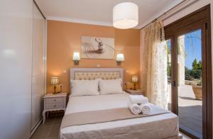 Postel nebo postele na pokoji v ubytování Casa Leone Suites