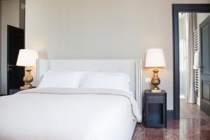 Postel nebo postele na pokoji v ubytování Palazzetto Foscari
