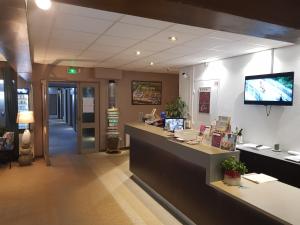 a lobby of a store with a cash register and a counter at FastHôtel Blois in Blois