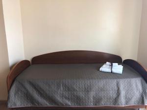 a bed with two towels sitting on top of it at Case Vacanze Ancora in Porto Empedocle