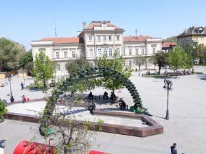 a sculpture in a plaza in front of a building at Prenociste Nikolas Grand in Smederevo